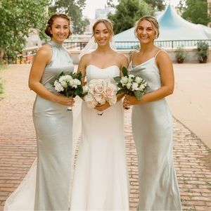 Bridesmaid dress with some water staining on the front side as shown in video.